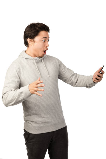 istock Screaming man with cellphone 1155180234