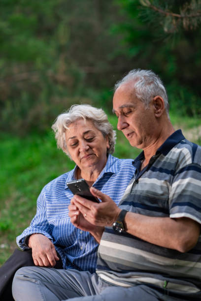 istock Senior couple check the map in the forest 1155180821