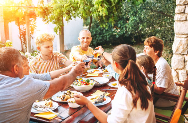 istock Big family have a dinner on garden terrace 1155182492