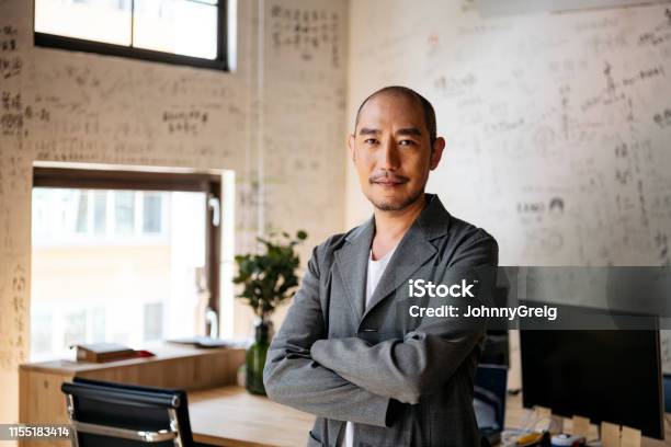 Portrait Of Chinese Businessman In Creative Office Stock Photo - Download Image Now - Asian and Indian Ethnicities, Men, Portrait