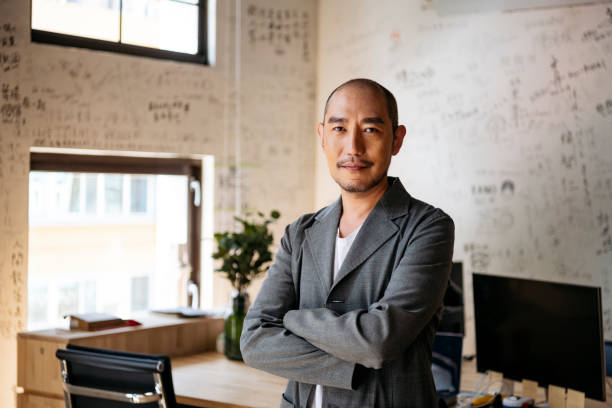 portrait of chinese businessman in creative office - men asia asian culture asian ethnicity imagens e fotografias de stock