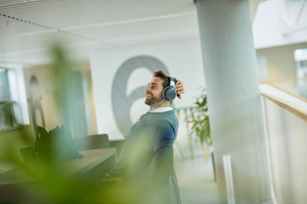 This work playlist really keeps me motivated stock photo