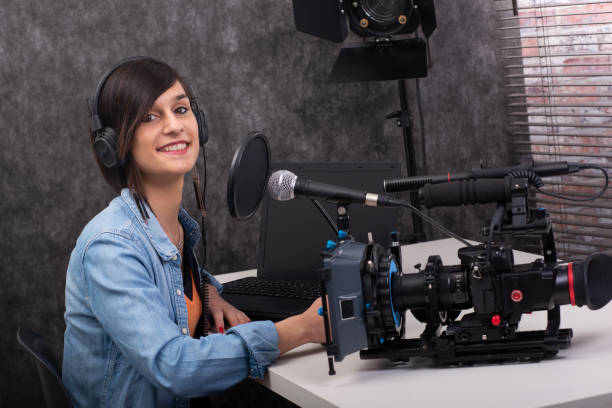 istock pretty young woman video editor working in studio 1155183686