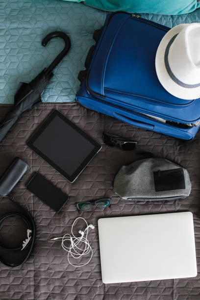 istock Top view of man's stuff ready for packing and going on a vacation 1155186242
