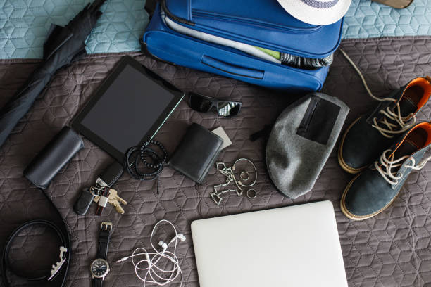 istock Top view of man's stuff ready for packing and going on a vacation 1155186243