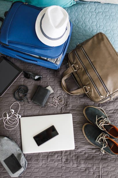 istock Top view of man's stuff ready for packing and going on a vacation 1155186249