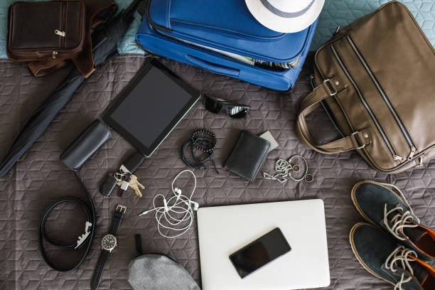 istock Top view of man's stuff ready for packing and going on a vacation 1155186250