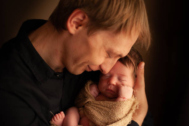 istock Father loving holding his newborn daughter 1155187794