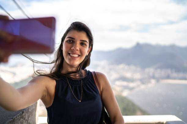 istock Beautiful woman taking a selfie in Rio de Janeiro 1155190842