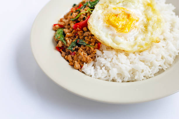 istock Rice topped with stir-fried pork with basil and fried egg 1155192064