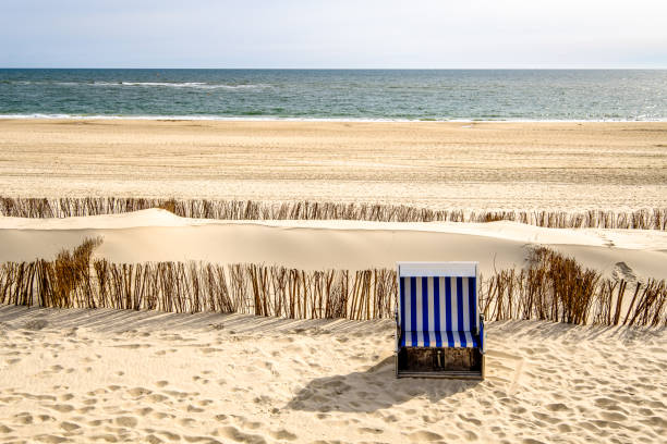 hooded beach chairs typical hooded beach chairs at a beach in north germany hooded beach chair stock pictures, royalty-free photos & images