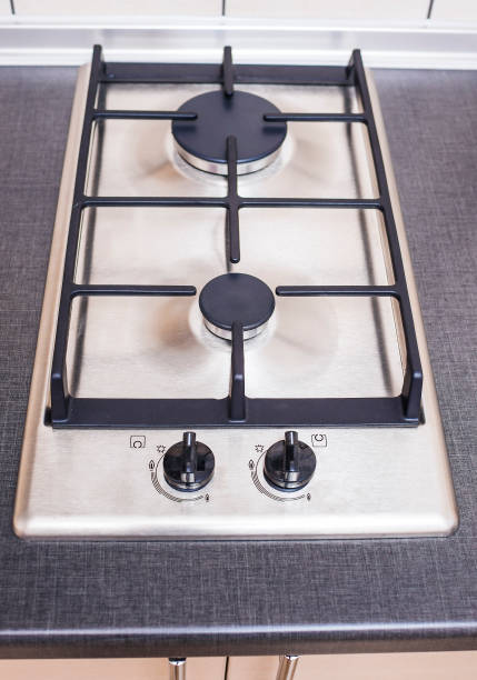 istock Closeup of Modern Double Burners Split Gas Oven. Vertical Image Orientation 1155199358