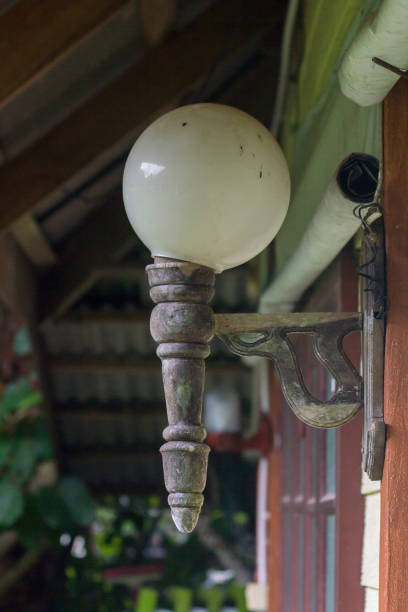 istock Old lamps attached to wooden walls 1155201480