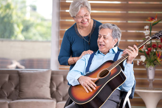 istock Senior couple with guitar at home 1155201845