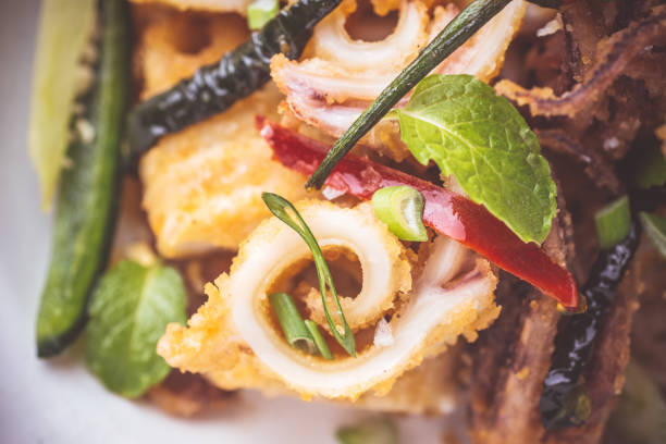 istock Fried Squid Calamari with Chili Pepper in Rustic White Plate 1155202988