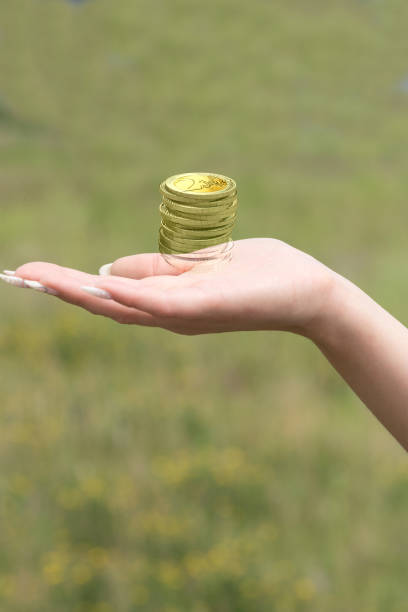 istock A woman has euro coins on her hand 1155203792