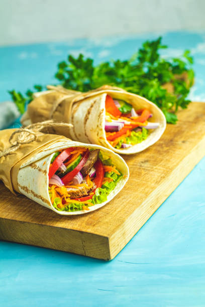 istock Shawarma sandwich with grilled meat, vegetables, cheese 1155203859