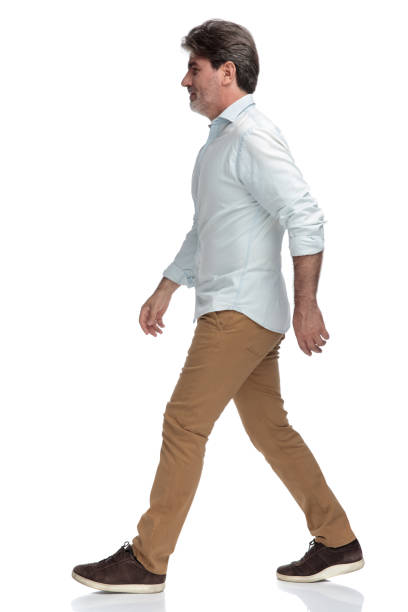 istock Determined old man walking to the side 1155204115