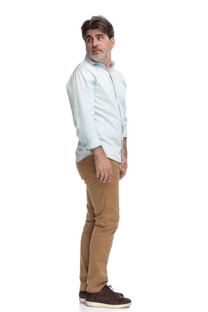 istock Side view of frightened old casual man looking behind 1155204169