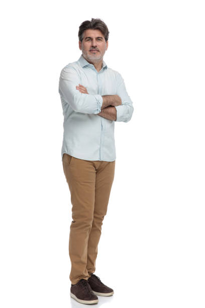 istock Confident casual old man standing with his arms folded 1155204416