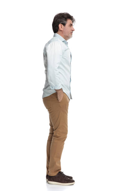 istock Thoughtful casual man holding both hands in his pocket 1155205638