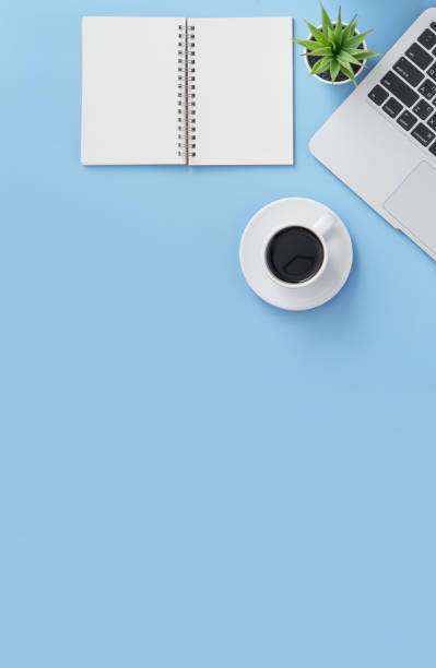 istock Business concept, relaxation in working time, drinking coffee taking a break on clean light blue office table, copy space, flat lay, top view, mockup 1155205792