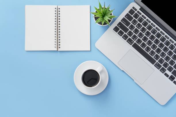 istock Business concept, relaxation in working time, drinking coffee taking a break on clean light blue office table, copy space, flat lay, top view, mockup 1155206026