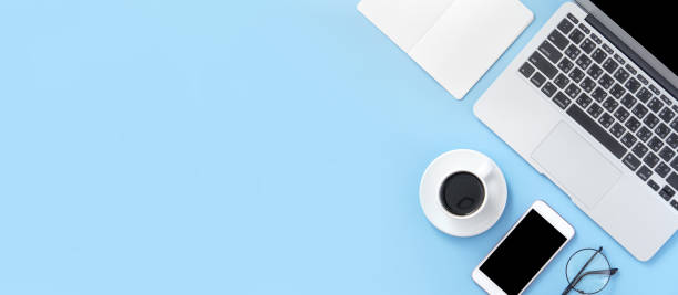 istock Business concept, relaxation in working time, drinking coffee taking a break on clean light blue office table, copy space, flat lay, top view, mockup 1155206165