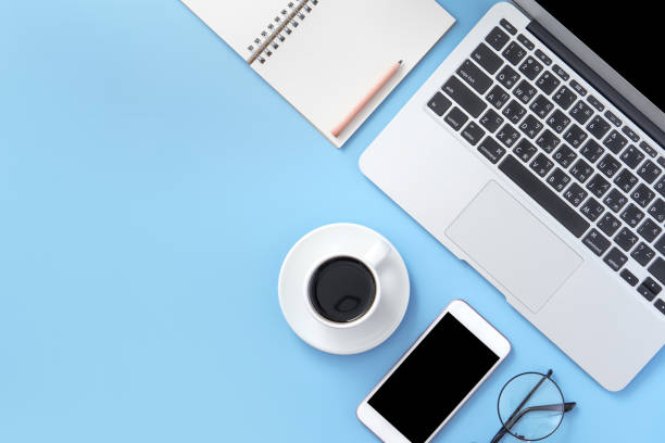 istock Business concept, relaxation in working time, drinking coffee taking a break on clean light blue office table, copy space, flat lay, top view, mockup 1155206243