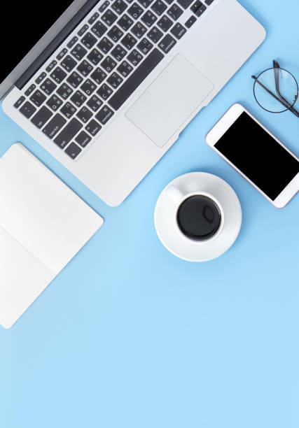 istock Business concept, relaxation in working time, drinking coffee taking a break on clean light blue office table, copy space, flat lay, top view, mockup 1155206265