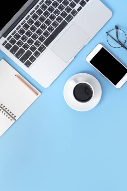 istock Business concept, relaxation in working time, drinking coffee taking a break on clean light blue office table, copy space, flat lay, top view, mockup 1155206389