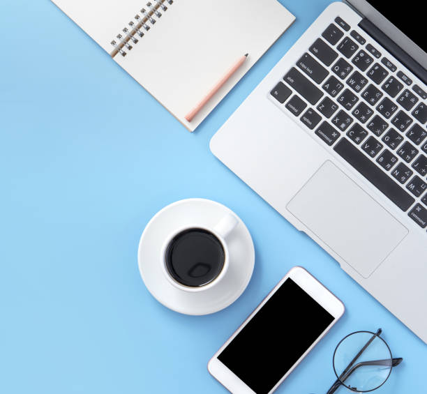 istock Business concept, relaxation in working time, drinking coffee taking a break on clean light blue office table, copy space, flat lay, top view, mockup 1155206422