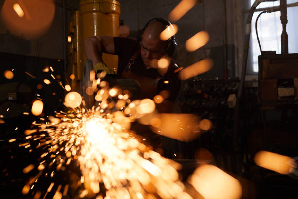 istock Busy factory worker sawing metal 1155206433