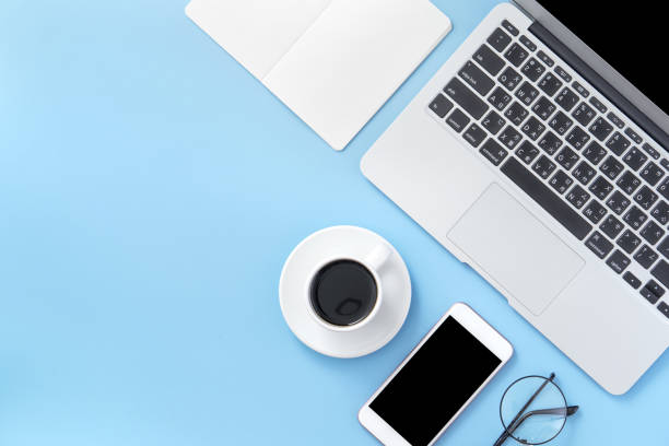 istock Business concept, relaxation in working time, drinking coffee taking a break on clean light blue office table, copy space, flat lay, top view, mockup 1155206480