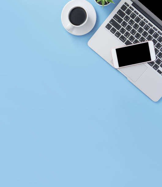 istock Business concept, relaxation in working time, drinking coffee taking a break on clean light blue office table, copy space, flat lay, top view, mockup 1155206574
