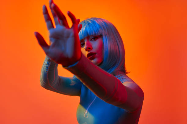 istock Futuristic woman protecting face from light 1155208734