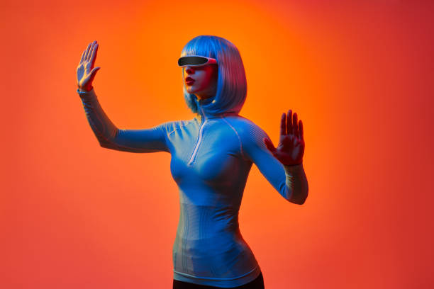 istock Woman in digital goggles interacting with virtual reality 1155208747