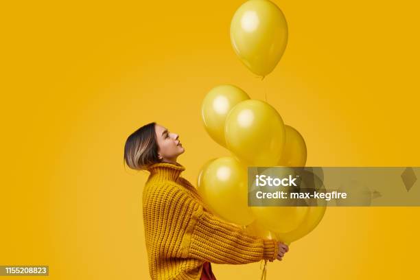 Young Woman Releasing Balloons Stock Photo - Download Image Now - Balloon, Women, People