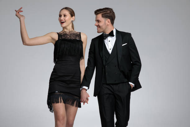 istock Joyful woman greeting while her boyfriend is holding her hand 1155208846