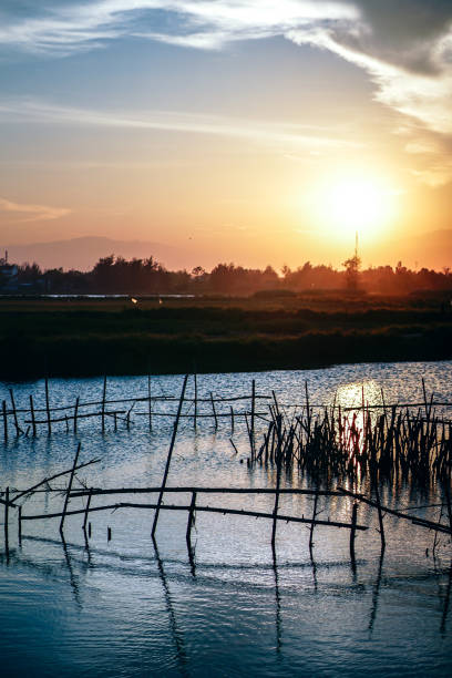 Sunset over a Small River in Hoi An stock photo