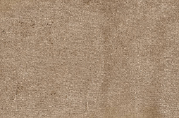 istock Old grungy canvas pattern with dirty spots in brown color. 1155208986