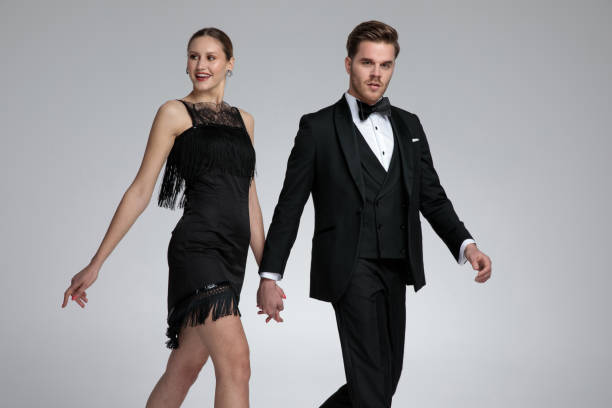 istock Happy couple walking to the side and holding hands 1155209290