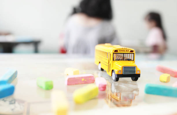 istock Yellow school bus toy model. 1155210733