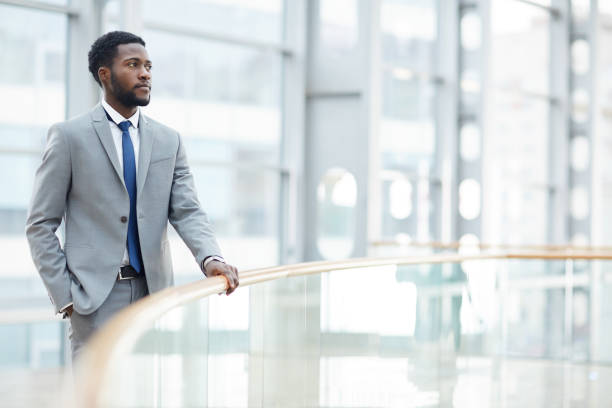 istock Pensive black businessman holding railing 1155211174