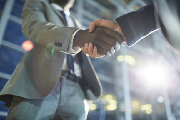 istock Making handshake after business deal 1155211821