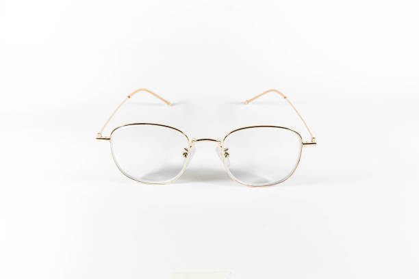 istock Gold frame spectacles glasses in a white isolated background 1155211823