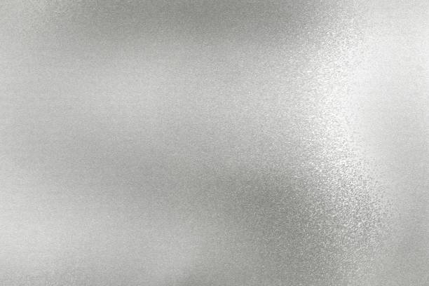 istock Glowing silver foil metal wall surface, abstract texture background 1155212509