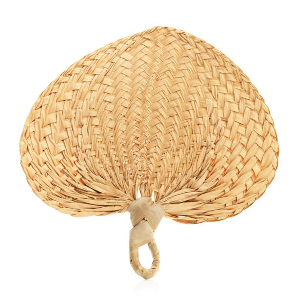 Isolated woven, straw fan on a white background