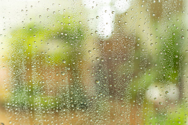 istock Rain drops on the glass, blurred background 1155212910