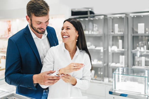 istock Attractive middle age couple at jewelry store 1155214457